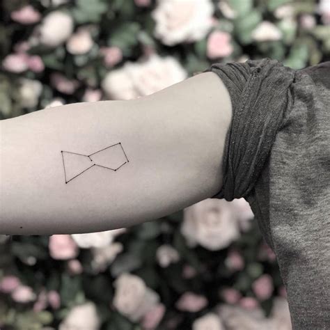 Orion constellation tattoo on the right bicep - Tattoogrid.net