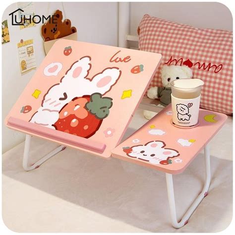 two tables with cartoon characters on them, one is holding a cup and the other has a teddy bear