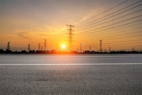 Electricity Tower Silhouette and Asphalt Road at Dusk Stock Image - Image of light, line: 174310165