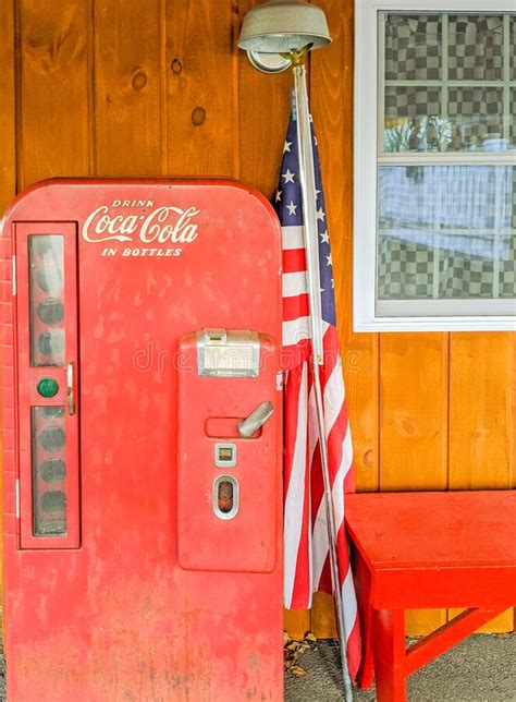 Old Time Coca Cola Machine and American Flag Editorial Photography - Image of time, flag: 181449587