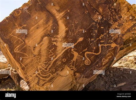 Fremont Culture petroglyphs on a rock art panel near Moore, in central Utah, USA. Shown are ...