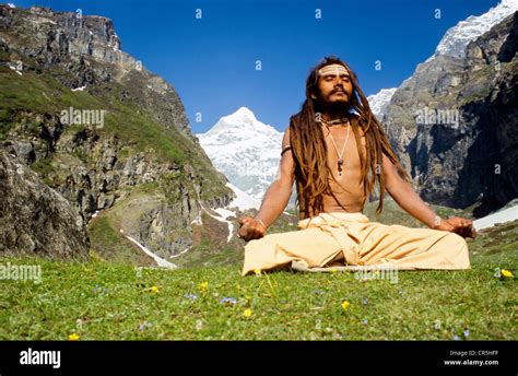 Shiva sadhu meditating next to his cave high above Badrinath Stock ...