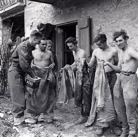 German prisoners of war being deloused before interrogation, Castel del Rio, Italy, October 1944 ...