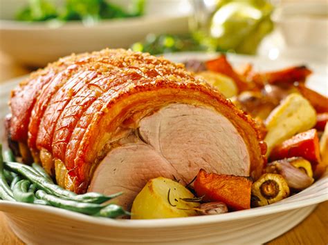 Roast pork leg with crackling, roasted vegetables and apple sauce | Australian Pork