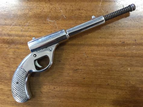 A British made chrome finished TG Harrington & Co Gat air pistol with ...