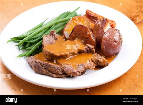 cross rib roast dinner with roasted vegetables Stock Photo - Alamy