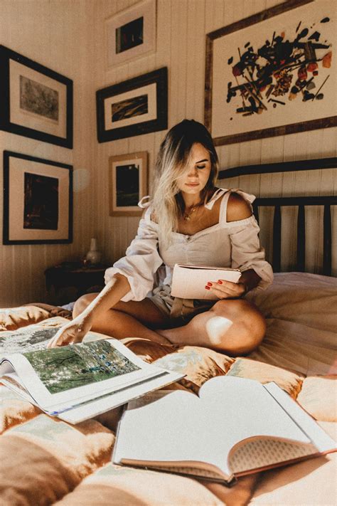 Photo Of Woman Reading Book On Bed · Free Stock Photo