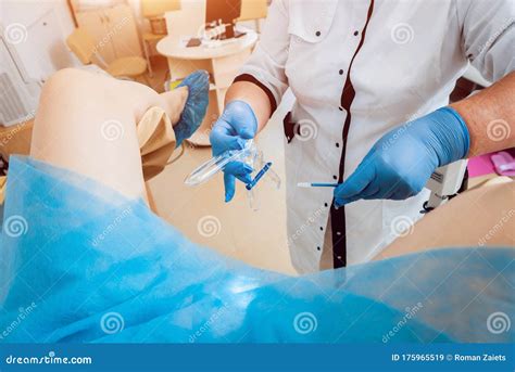 Woman in Gynecological Chair during Gynecological Check Up with Her ...