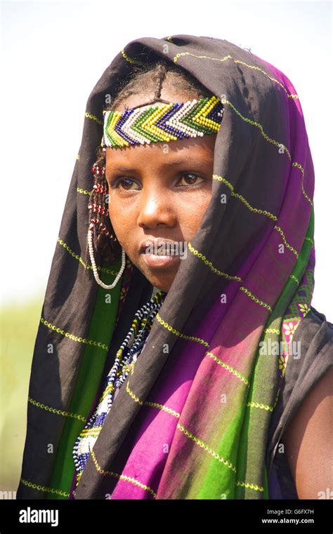 An Afar girl in tribal attire. The nomadic Afar live in the low-lying ...