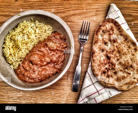 Coop Indian chicken Madras with Pilau rice and Naan bread Stock Photo ...