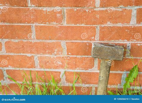 Sledgehammer at the Brick Wall and Place for Text Stock Photo - Image ...