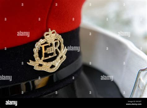 A Royal Military Police peaked cap and white belt from a Military Police dress uniform Stock ...