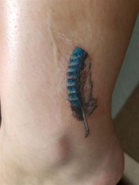 Small blue jay feather tattoo from Joe at Golden Needle in Moorhead, MN | Tattoos, Small blue ...