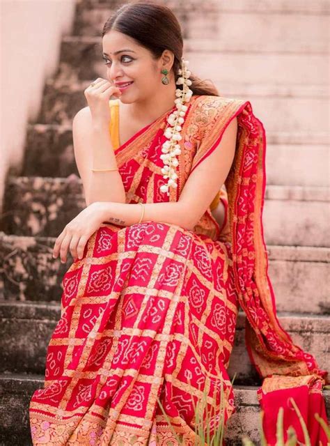 Janani Iyer captures hearts in a Bandhej print red saree and sleeveless ...