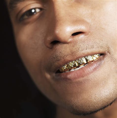 Why Do Rappers Wear Gold Teeth - Live Enhanced