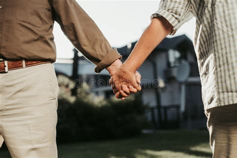 Couple Holding Their Arms As they are Bonded Stock Photo - Image of ...