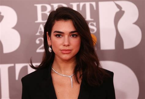 Dua Lipa in tears after fans reportedly dragged out of Shanghai show for waving LGBTQ flags ...