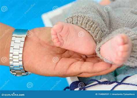 Newborn Baby Feet and Hands of Parents Stock Image - Image of close ...