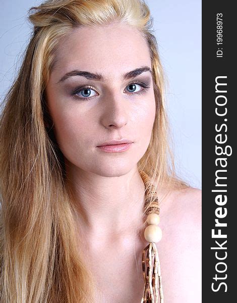 1+ Portrait pretty blond girl wearing wooden beads Free Stock Photos - StockFreeImages