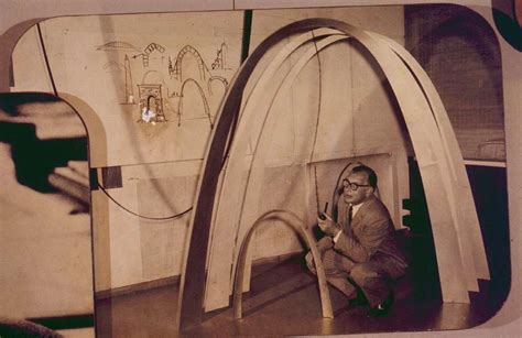 Eero Saarinen kneeling beneath a model of the Gateway Arch. - PICRYL ...