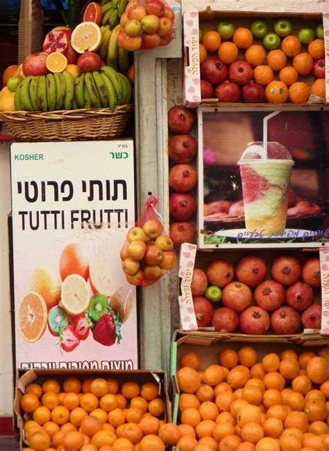 oranges and other fruits are on display in baskets