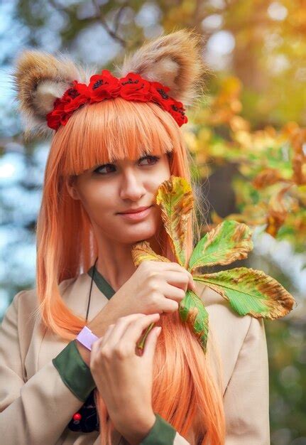 Premium Photo | Wolf girl cosplay character in autumn park. anime festival