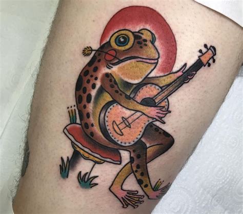 frog playing banjo tattoo meaning - winterartillustrationhouse