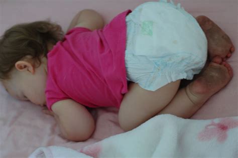 Sleeping baby with filthy feet | Amanda Westmont | Flickr