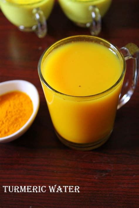 there are three glasses of orange juice and two bowls of turmeric water ...