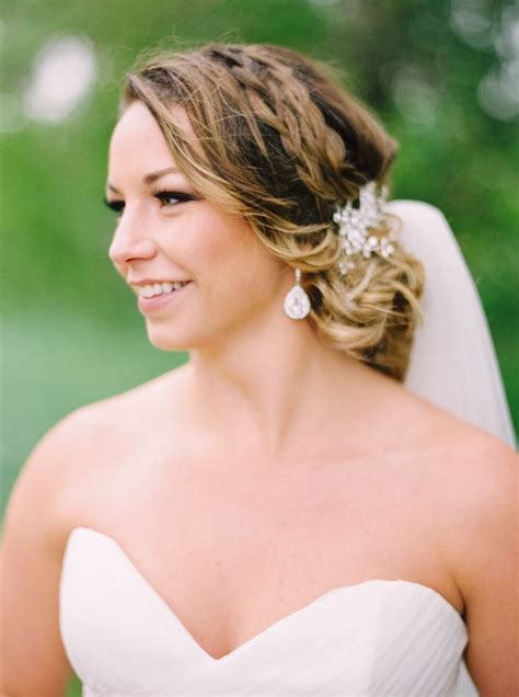 a woman in a wedding dress smiles at the camera