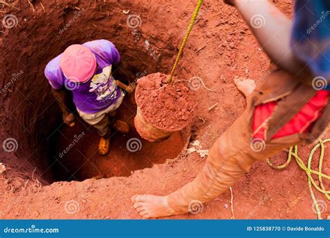 Young Boys Manually Digging Well with Bucket Full of Soil in African Small Village Editorial ...