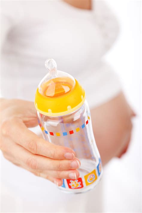 Mother With A Feeding Bottle Free Stock Photo - Public Domain Pictures