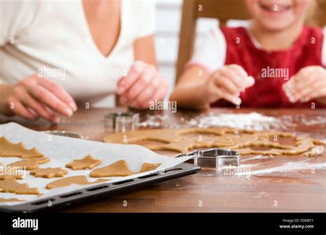 Little girl baking christmas cookies Stock Photo - Alamy