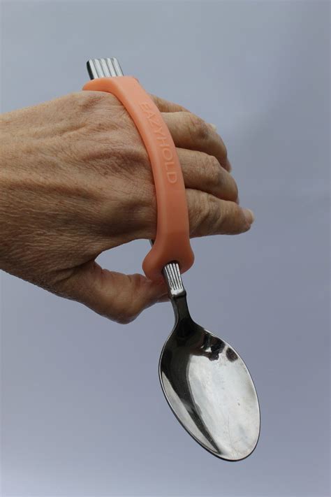 Eazyholds on a marker, a toothbrush and a razor. A revolutionary new strap that can easily be ...