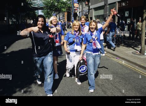 Female Rangers Football Fans In Manchester Scottish Supporters Replica Shirts Merchandise Stock ...