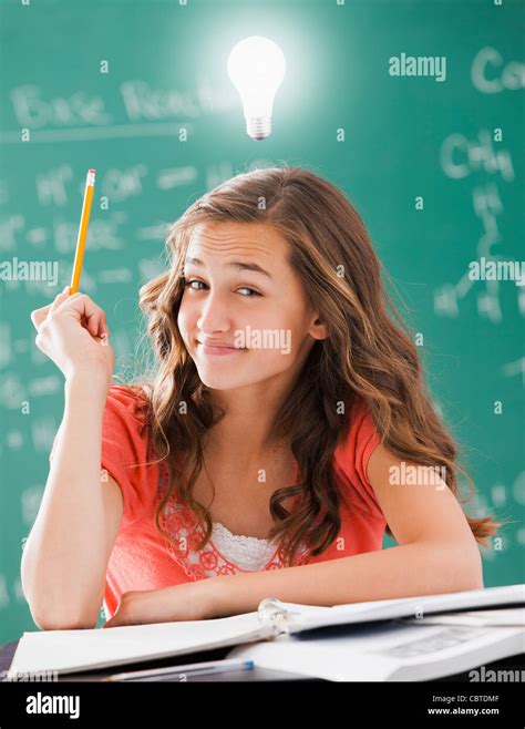 Caucasian student with light bulb over her head Stock Photo - Alamy