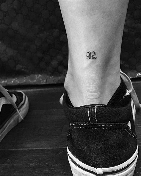 92 tattoo on the Achilles heel.