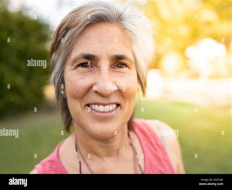 woman with senior white hair, pretty girl smiling, nature background ...