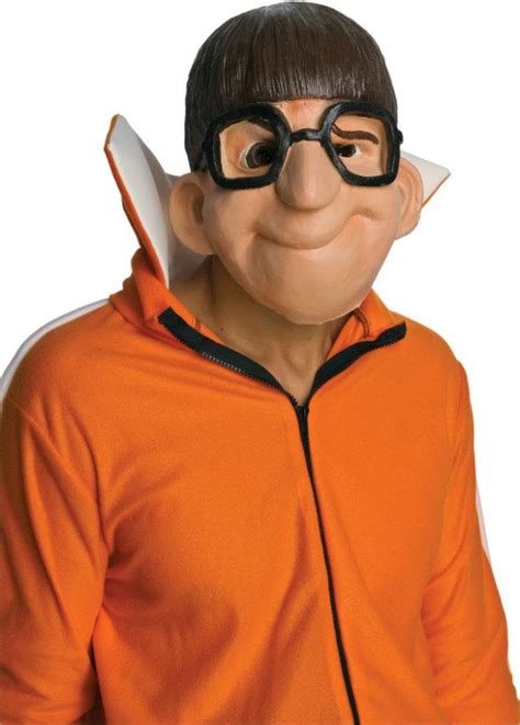 a man wearing an orange jacket and black glasses