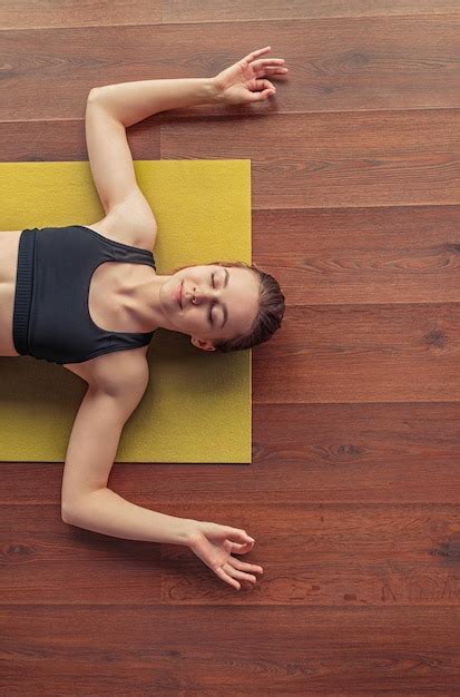 Premium Photo | Calm female practicing yoga and showing om gesture