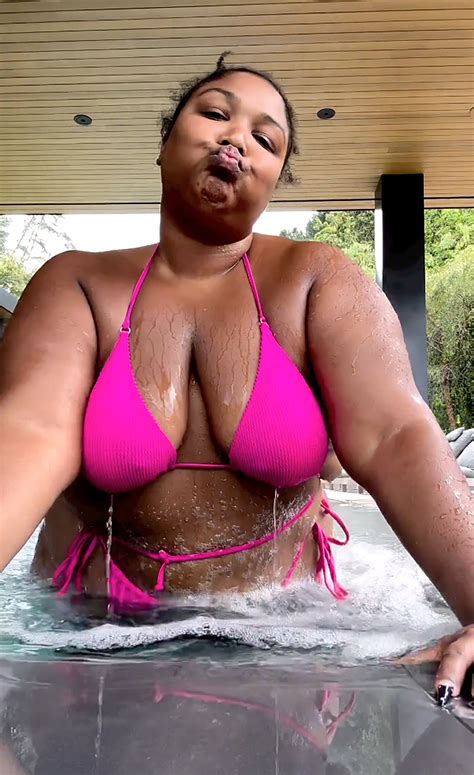 Lizzo dances in strappy pink bikini as she skips Coachella 2023