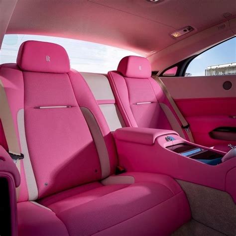 the interior of a car with pink leather