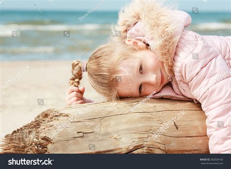 Little Girl Beach Lying On Log Stock Photo 282028163 | Shutterstock