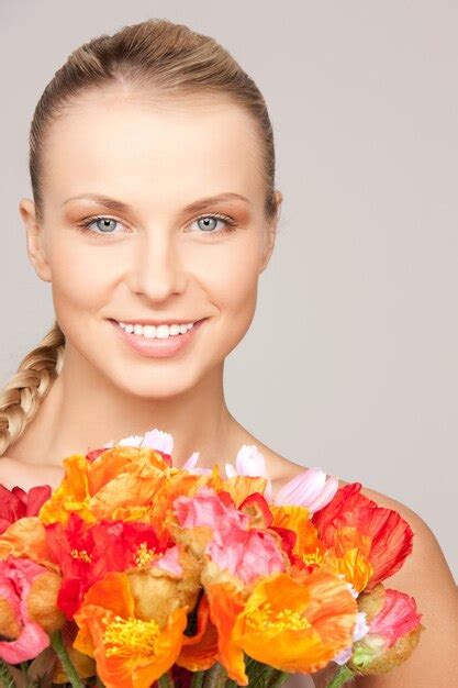 Premium Photo | Picture of lovely woman with red flowers