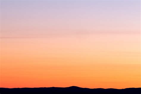 Silhouette Photo of a Mountain during Sunset · Free Stock Photo