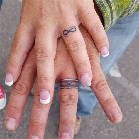 wedding-ring-tattoo+(13) | Ring finger tattoos, Ring tattoo designs, Wedding band tattoo