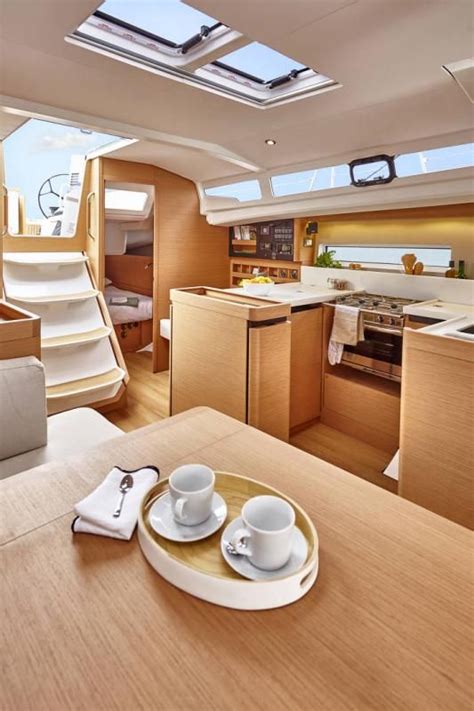 the interior of a boat with two cups and saucers on a plate in front of it