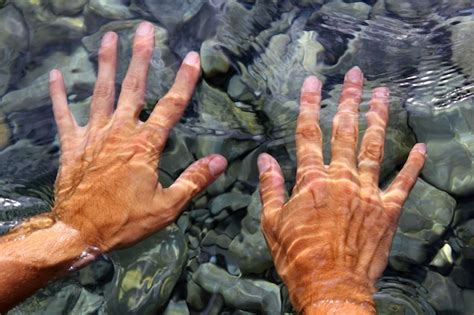 Premium Photo | Hands underwater river water wavy shapes