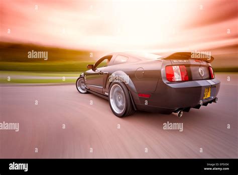 Ford Shelby Mustang GT500 motion shot from the rear, moving image, panned, rig shot with sun ...