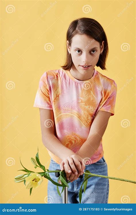 Girl with Cerebral Palsy Holding Lily Flower and Looking at Camera Stock Image - Image of lily ...